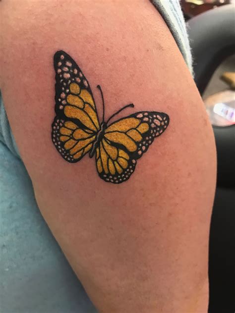 yellow butterfly tattoo